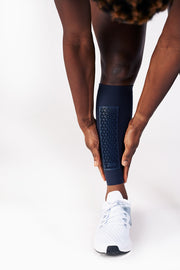 Phyllis Agbo adjusting her Blue Elvin shin sleeves, with shin protection panels.